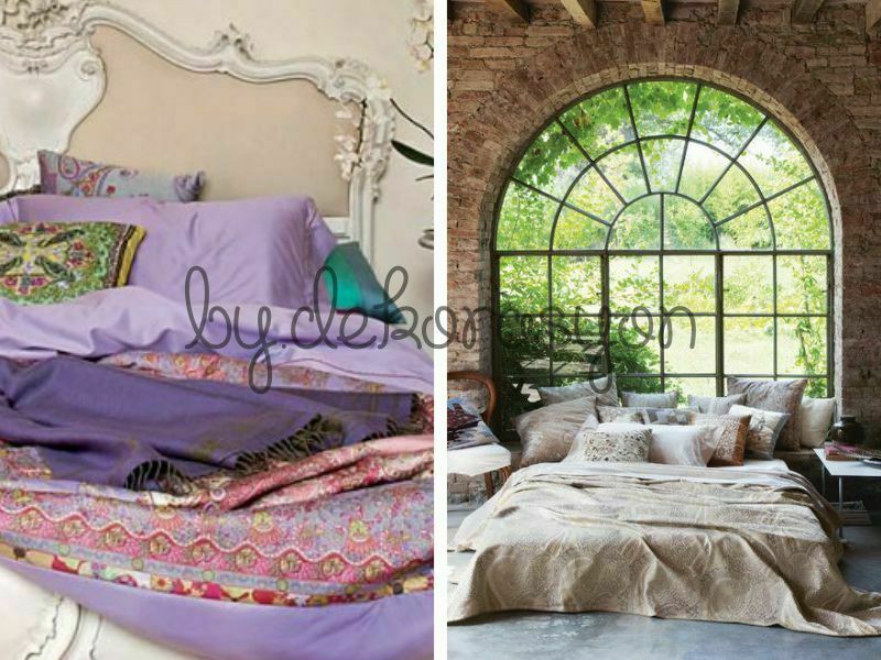Etro Home koleksiyonundan şal desenli yatak örtüsü, yastıklar ve koltukla dekore edilmiş şık bir oda.
