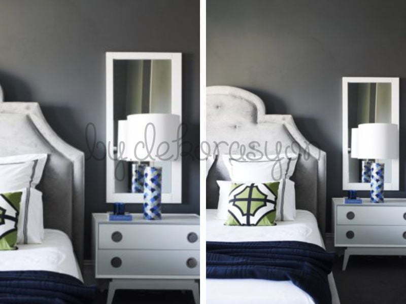 Lacivert duvarlar ve gri mobilyalarla bir salon köşesi